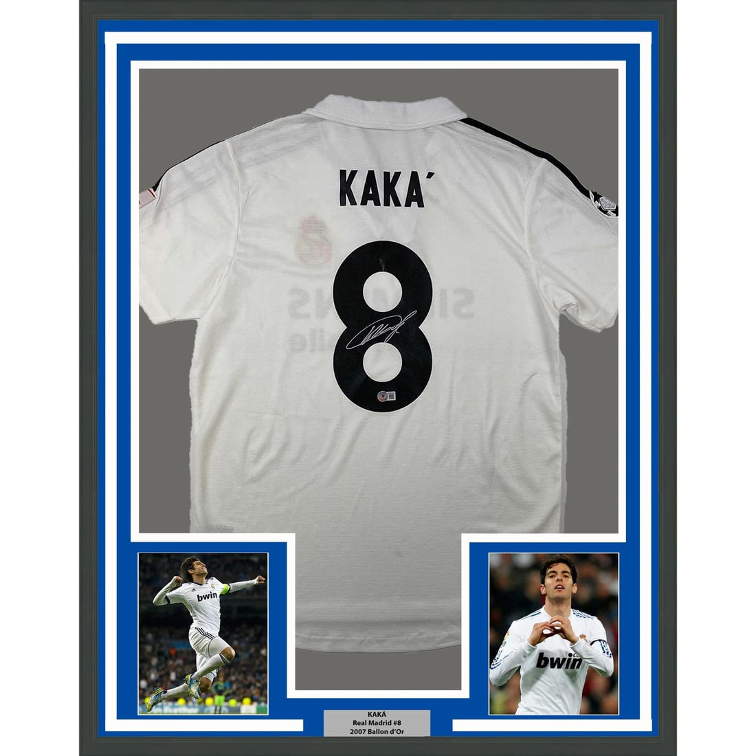 Framed Real Madrid Kaka autographed jersey with 2 photos 35x39: Framed Real Madrid Kaka autographed jersey with 2 photos 35x39 This framed Real Madrid white football jersey is autographed by Ricardo Kaka and authenticated by Beckett Grading Services. The display i