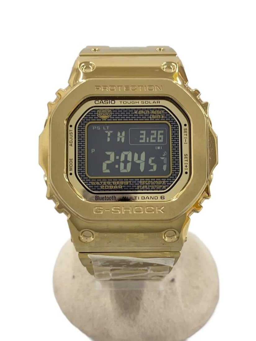 Casio G Shock Gold Stainless Steel Wristwatch GMW-B5000GD-9JF: Casio G Shock Gold Stainless Steel Wristwatch GMW-B5000GD-9JF This CASIO G-SHOCK GMW-B5000GD-9JF men's wristwatch features a durable stainless steel construction in a striking gold color. Made in Japa