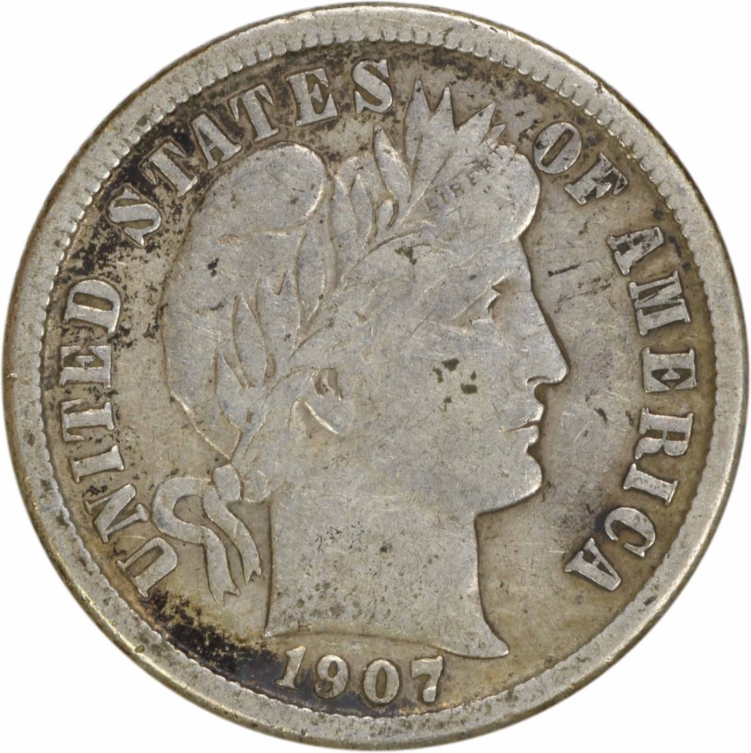1907-O Barber Silver Dime 10C Circulated Uncertified: 1907-O Barber Silver Dime 10C Circulated Uncertified This 1907-O Barber Silver Dime is a classic piece of American numismatics, featuring the iconic design by Charles E. Barber. Struck in New Orleans,