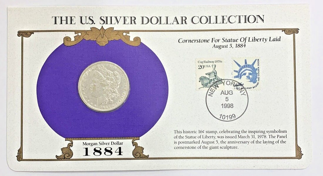 1884 Morgan Dollar Silver Coin with Commemorative Stamp Display Card: 1884 Morgan Dollar Silver Coin with Commemorative Stamp Display Card This collection features a circulated 1884 Morgan Silver Dollar, minted in Philadelphia, presented with a commemorative stamp card.