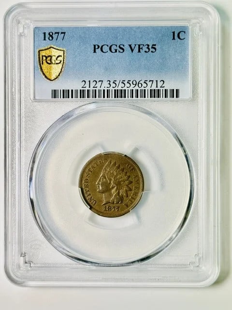 1877 Indian Head Cent PCGS VF-35 BN: 1877 Indian Head Cent PCGS VF-35 BN This 1877 Indian Head Penny is certified by PCGS with a grade of VF 35 BN. Struck in copper at the Philadelphia Mint, this cent is a pre-owned collectible from the 