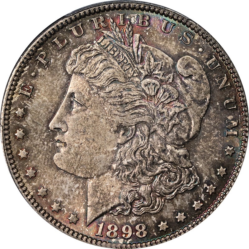 PCGS MS64 1898-P Morgan Silver Dollar Toned: PCGS MS64 1898-P Morgan Silver Dollar Toned This is an 1898 Morgan Silver Dollar minted at the Philadelphia Mint, graded MS64 by PCGS. The coin is uncirculated and features attractive toning. It is co