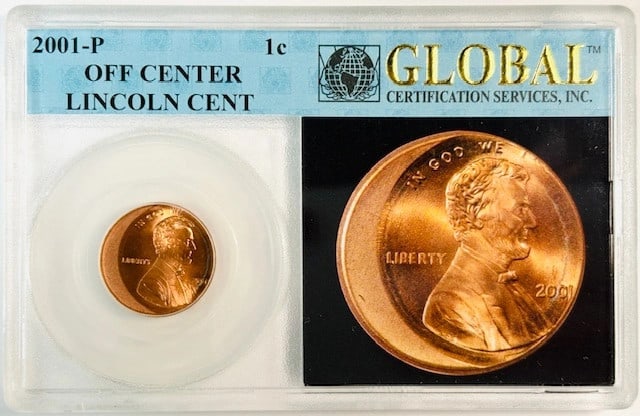 2001 Philadelphia Off Center Lincoln Cent in Holder: 2001 Philadelphia Off Center Lincoln Cent in Holder This is a 2001 P Lincoln Memorial penny featuring an off-center strike. The coin is composed of copper and was minted in Philadelphia. It is housed 