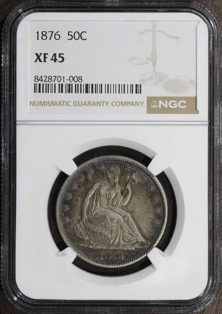 1876 Seated Liberty Half Dollar NGC XF45 Silver 50C: 1876 Seated Liberty Half Dollar NGC XF45 Silver 50C This 1876 Seated Liberty Half Dollar is graded XF45 by the Numismatic Guaranty Company (NGC). Struck in Philadelphia, this circulated coin is compos