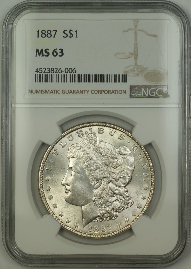 NGC MS 63 1887 Morgan Dollar Silver $1 Philadelphia: NGC MS 63 1887 Morgan Dollar Silver $1 Philadelphia This 1887 Morgan Silver Dollar features a $1 denomination and was minted in Philadelphia. The coin is certified by NGC with a grade of MS 63, indica