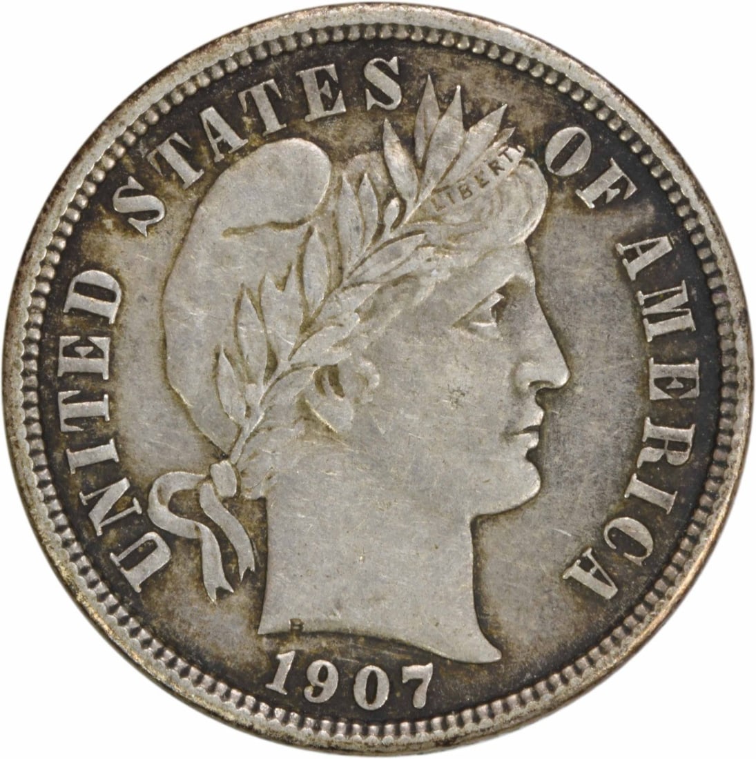 1907 Barber Dime AU Uncertified 90% Silver Coin: 1907 Barber Dime AU Uncertified 90% Silver Coin This 1907 Barber Silver Dime is a beautiful piece of American numismatic history. Struck in Philadelphia, this coin features the iconic design by Charle
