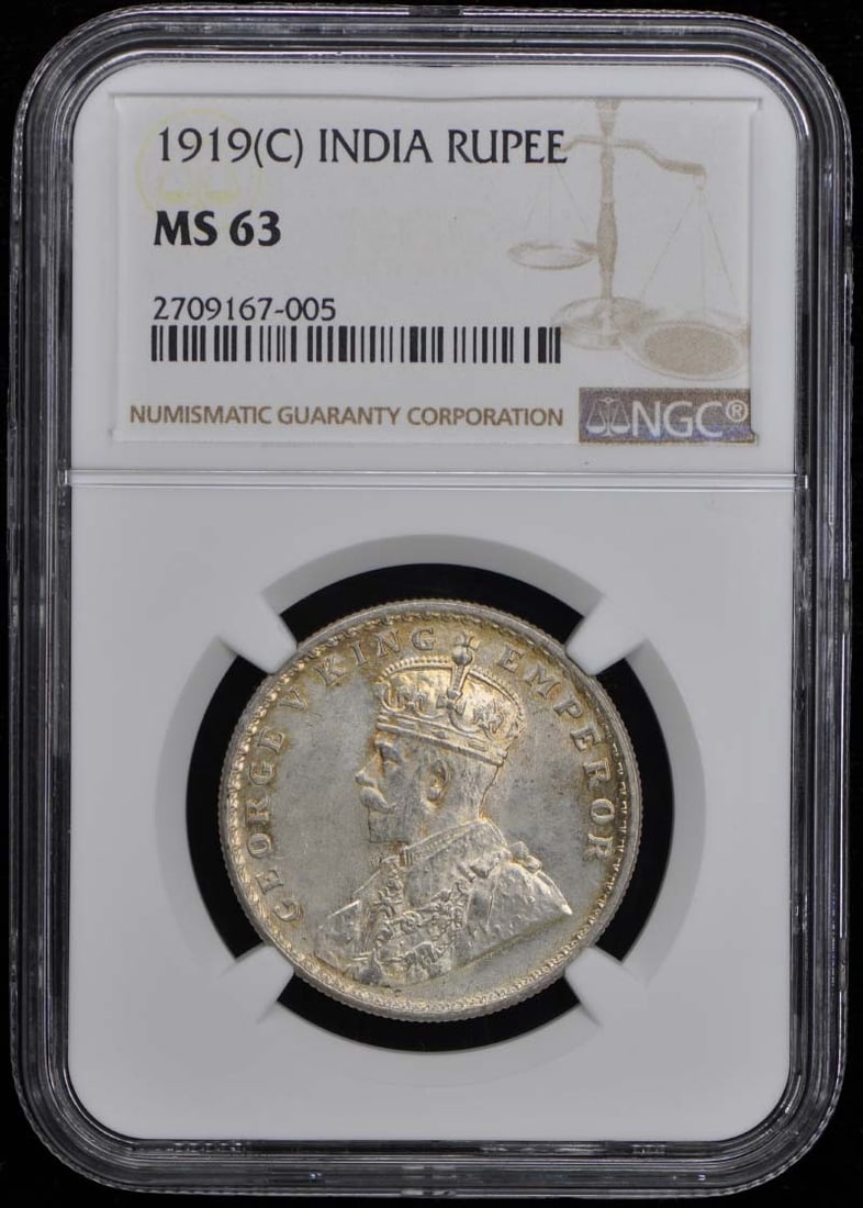 1919 India Rupee NGC MS63 Uncirculated Coin: 1919 India Rupee NGC MS63 Uncirculated Coin This 1919 India Rupee is certified by NGC with a grade of MS63, indicating its uncirculated condition. A remarkable piece for collectors, this coin showcase