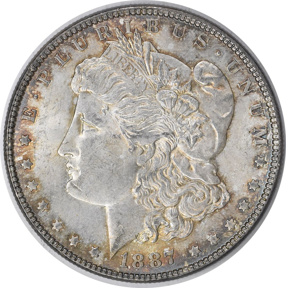 Choice BU 1887 Toned Morgan Silver Dollar Uncertified Philadelphia Mint: Choice BU 1887 Toned Morgan Silver Dollar Uncertified Philadelphia Mint This is an 1887 Morgan Silver Dollar featuring attractive toning. The coin is uncirculated and graded as Choice BU. It was minte
