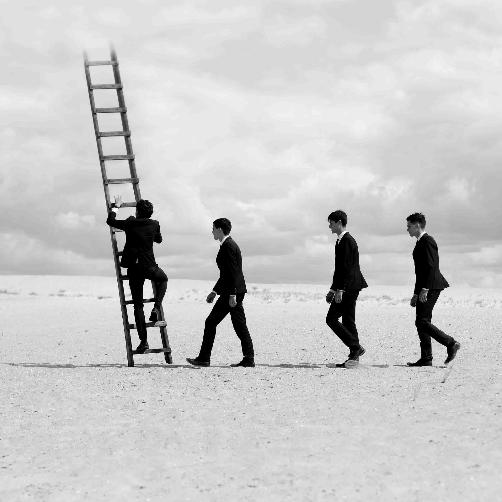 Olha Stepanian Men 24x24 B W Signed Numbered Photo Edition 4 of 15: Olha Stepanian Men 24x24 B W Signed Numbered Photo Edition 4 of 15 This is a black and white photographic print titled "Men" by Olha Stepanian, created in 2017. The artwork is part of a limited editio