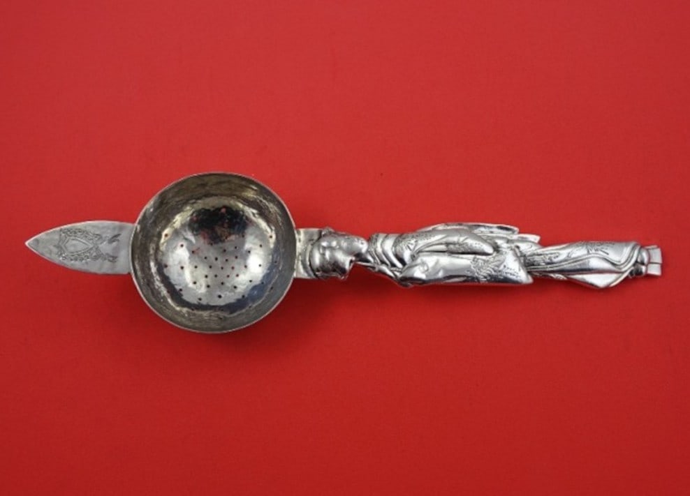 Japanese .950 Silver Tea Strainer with Geisha Handle by Musashiya Hand Hammered 9 5/8": Japanese .950 Silver Tea Strainer with Geisha Handle by Musashiya Hand Hammered 9 5/8" This Japanese tea strainer by Musashiya is crafted from .950 silver and features a hand-hammered finish. The desi
