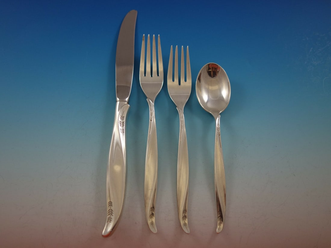 International Sterling Silver Pine Spray 4-Piece Place Setting: International Sterling Silver Pine Spray 4-Piece Place Setting Enhance your dining experience with this exquisite 4-piece place setting in the elegant Pine Spray pattern by International. Crafted from
