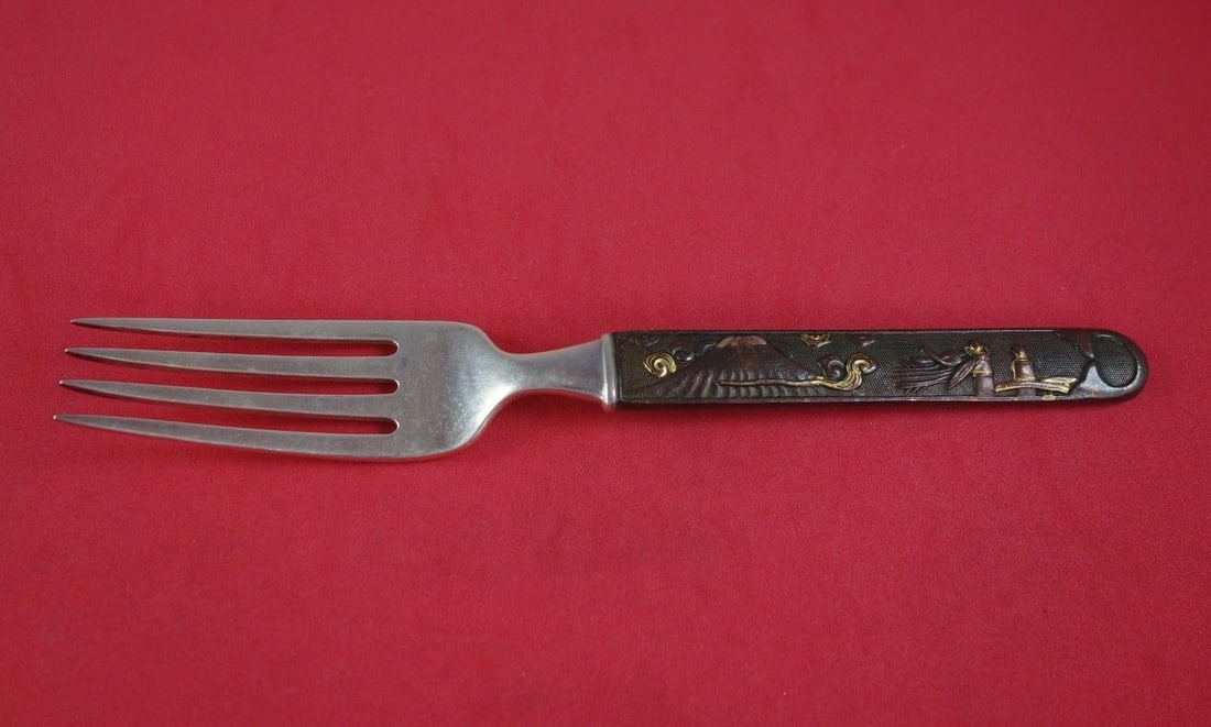 Tiffany & Co Kozuka Sterling Silver Copper Bronze Dinner Fork 7 3/8": Tiffany & Co Kozuka Sterling Silver Copper Bronze Dinner Fork 7 3/8" This exquisite dinner fork from Tiffany & Co. features the Kozuka pattern, showcasing a beautifully crafted handle made of copper a
