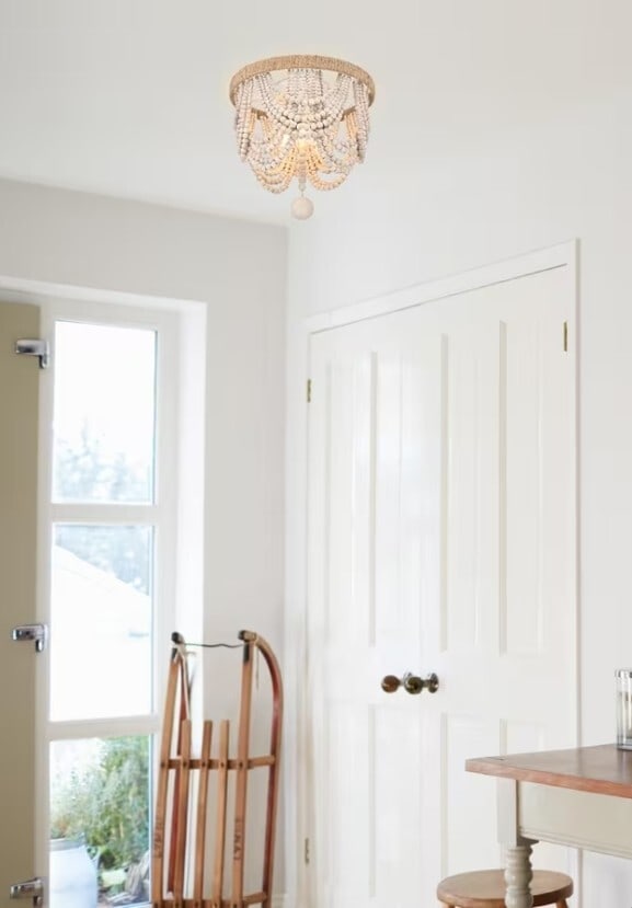 LIVING DISTRICT 3-Light Antique White Flush Mount Chandelier: LIVING DISTRICT 3-Light Antique White Flush Mount Chandelier This flush mount chandelier features a farmhouse-inspired design with wood bead embellishments and hand rope knot detailing, finished in an