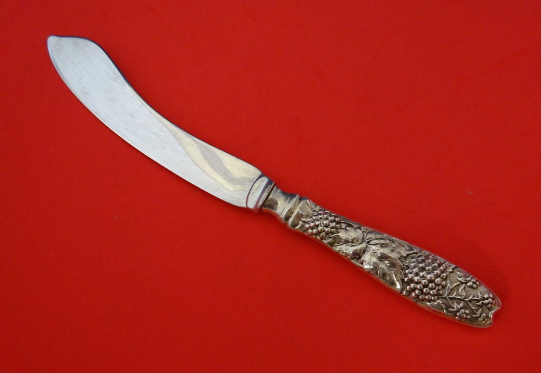 Tiffany & Co Blackberry Sterling Silver Fish Knife 7 1/8 Inch: Tiffany & Co Blackberry Sterling Silver Fish Knife 7 1/8 Inch Introducing the exquisite Blackberry fish knife by Tiffany & Co., a remarkable example of fine craftsmanship in sterling silver. This exce