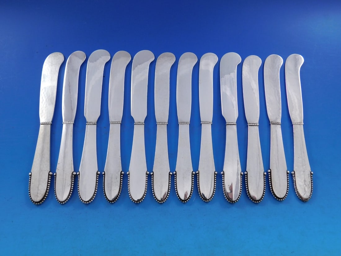 Georg Jensen Beaded Sterling Silver Butter Spreader Set of 12: Georg Jensen Beaded Sterling Silver Butter Spreader Set of 12 This exquisite set of 12 butter spreaders from Georg Jensen showcases the elegant Beaded pattern. Crafted from sterling silver, each sprea
