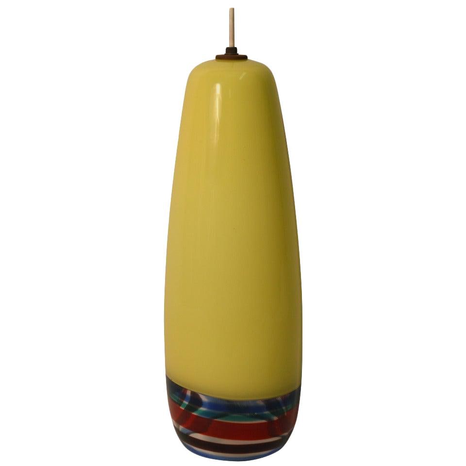 Massimo Vignelli Large Venini Sigaro Pendant Light Yellow Art Glass: Massimo Vignelli Large Venini Sigaro Pendant Light Yellow Art Glass This striking Venini Sigaro Pendant Fixture, designed by Massimo Vignelli, features a vibrant lemon yellow art glass body with a col