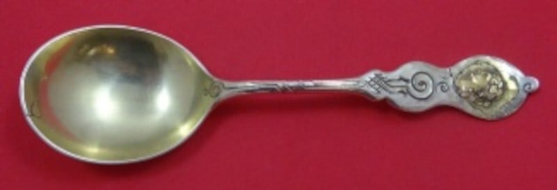 Shiebler Sterling Silver Medallion Preserve Spoon with Gold Detail 7.5": Shiebler Sterling Silver Medallion Preserve Spoon with Gold Detail 7.5" This exquisite serving spoon showcases the Medallion pattern, also known as Etruscan or Homeric, crafted by Shiebler. Made from 