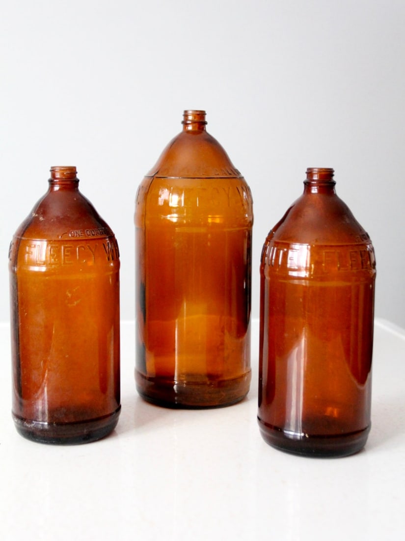 Vintage Set of 3 Antique Brown Glass Bottles 1938 John Puhl: Vintage Set of 3 Antique Brown Glass Bottles 1938 John Puhl This exquisite set of three antique brown glass bottles, originating from circa 1938, showcases the craftsmanship of The John Puhl Products 