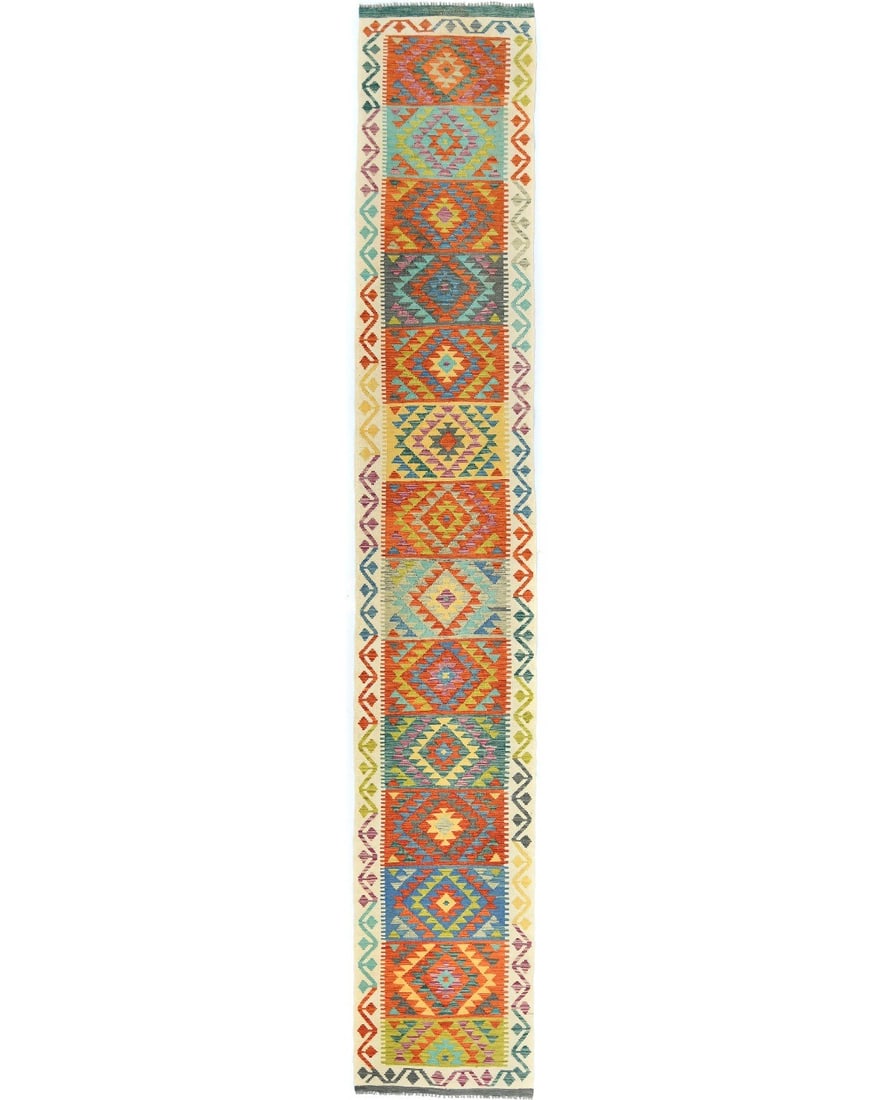 16 ft Wool Geometric Kilim Runner Rug Farmhouse Reversible: 16 ft Wool Geometric Kilim Runner Rug Farmhouse Reversible Enhance your space with this Farmhouse Boho Geometric Reversible Kilim Runner Rug. Measuring 2'7" x 16'0", this handmade rug features a vibra