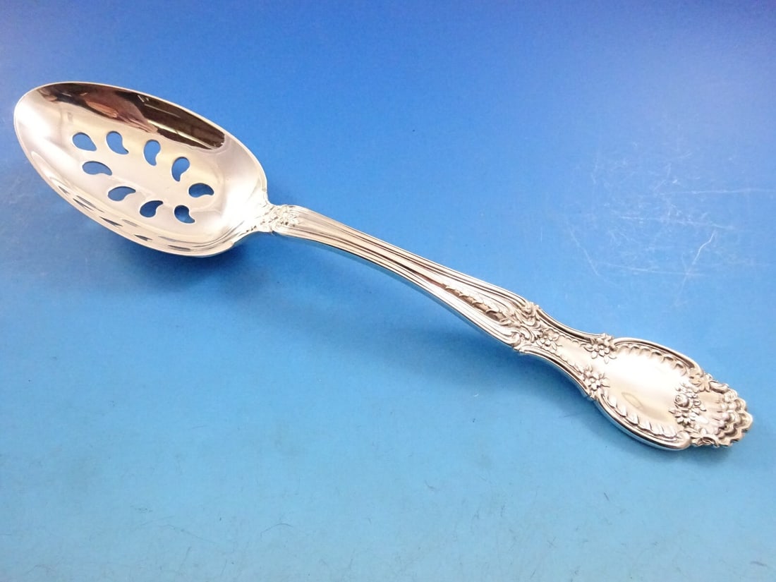 Tiffany & Co. Richelieu Sterling Silver 9-Hole Slotted Spoon: Tiffany & Co. Richelieu Sterling Silver 9-Hole Slotted Spoon Enhance your dining experience with this exquisite Richelieu serving spoon by Tiffany & Co. Crafted from high-quality sterling silver, this