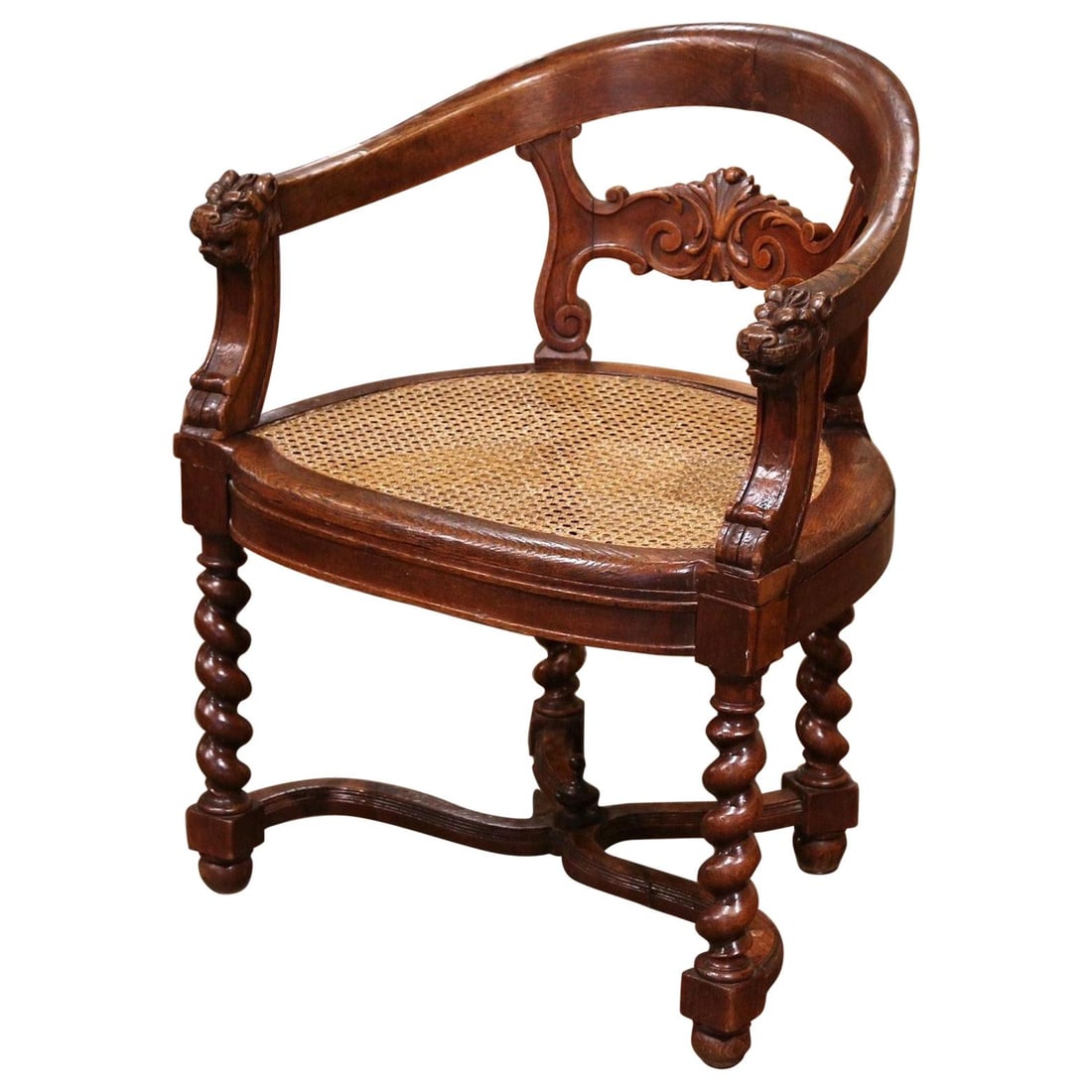 19th Century French Oak Barrel Armchair with Lion Heads and Cane Seat: 19th Century French Oak Barrel Armchair with Lion Heads and Cane Seat This exquisite 19th Century French Renaissance Oak Barrel Armchair showcases the elegance of the Renaissance Revival style. Crafte