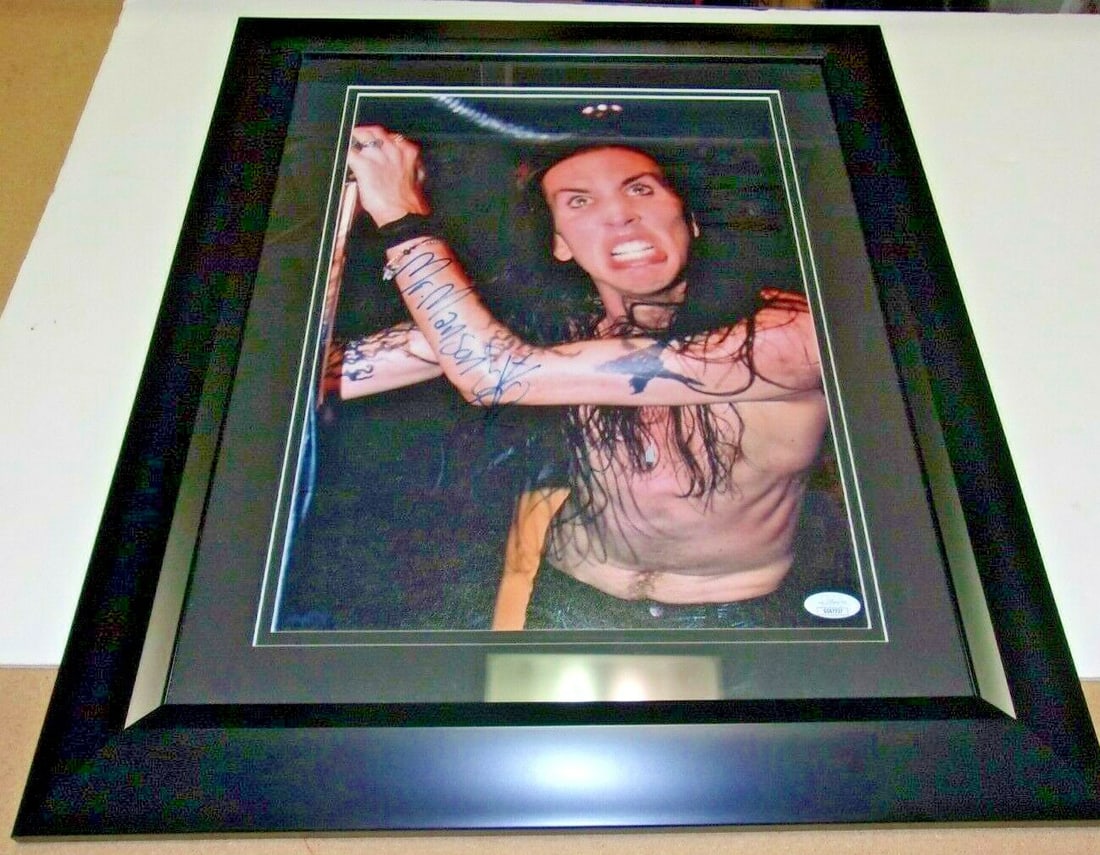 Framed 17x22 Marilyn Manson Signed Photo With Sketch JSA Authenticated: Framed 17x22 Marilyn Manson Signed Photo With Sketch JSA Authenticated This is an original signed and framed 17x22 inch photo featuring Marilyn Manson. The photo includes a full signature along with a