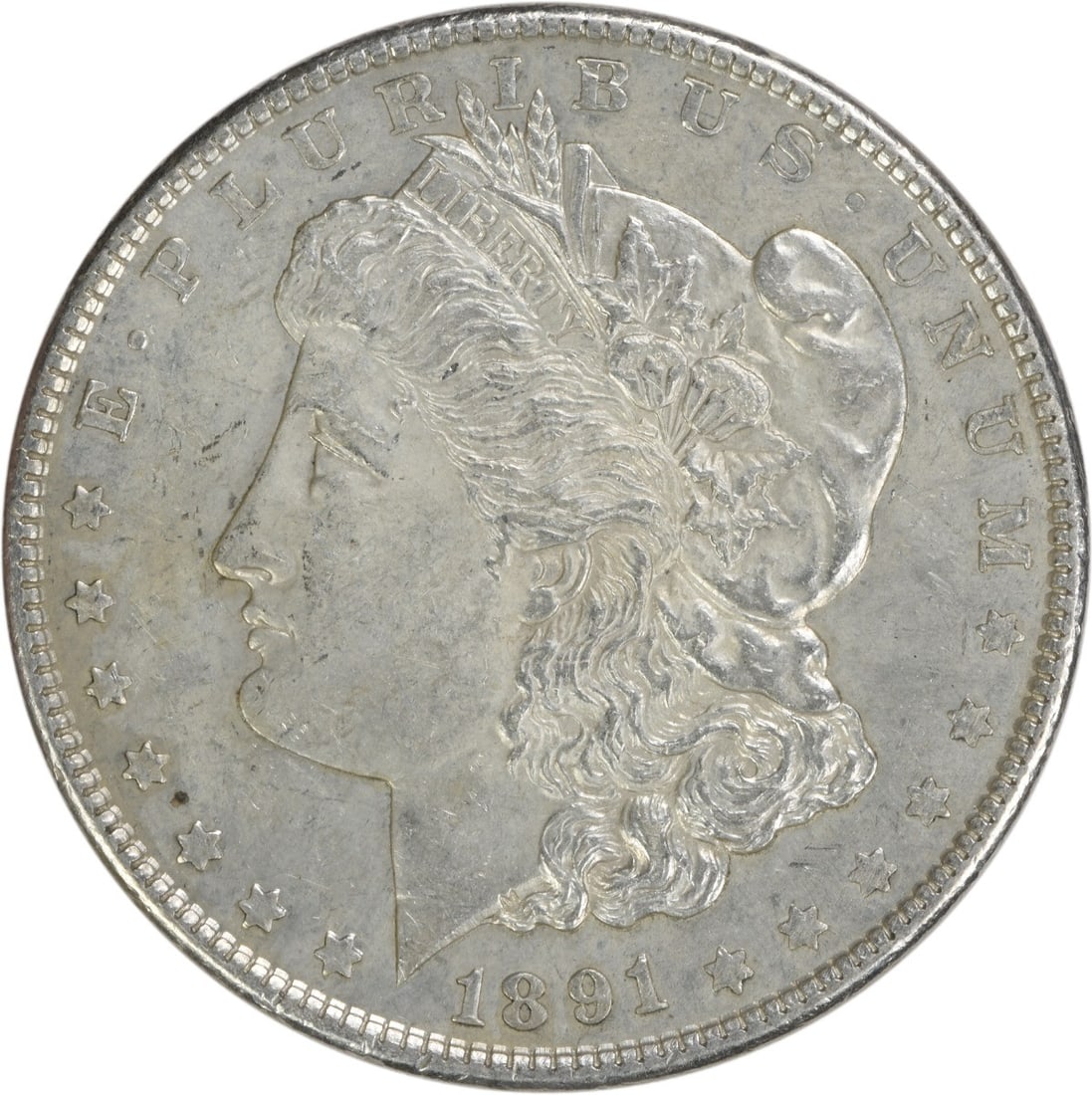 1891 Morgan Silver Dollar AU Uncertified 90% Silver Coin: 1891 Morgan Silver Dollar AU Uncertified 90% Silver Coin This 1891 Morgan Silver Dollar is a beautiful example of American coinage designed by George T. Morgan. It features a composition of 90% silver