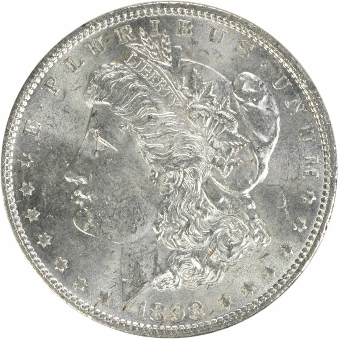 Brilliant Uncirculated 1898 Morgan Dollar Silver Coin Uncertified: Brilliant Uncirculated 1898 Morgan Dollar Silver Coin Uncertified This is an uncirculated 1898 Morgan Silver Dollar from the United States. The coin is composed of silver, has a denomination of $1, an