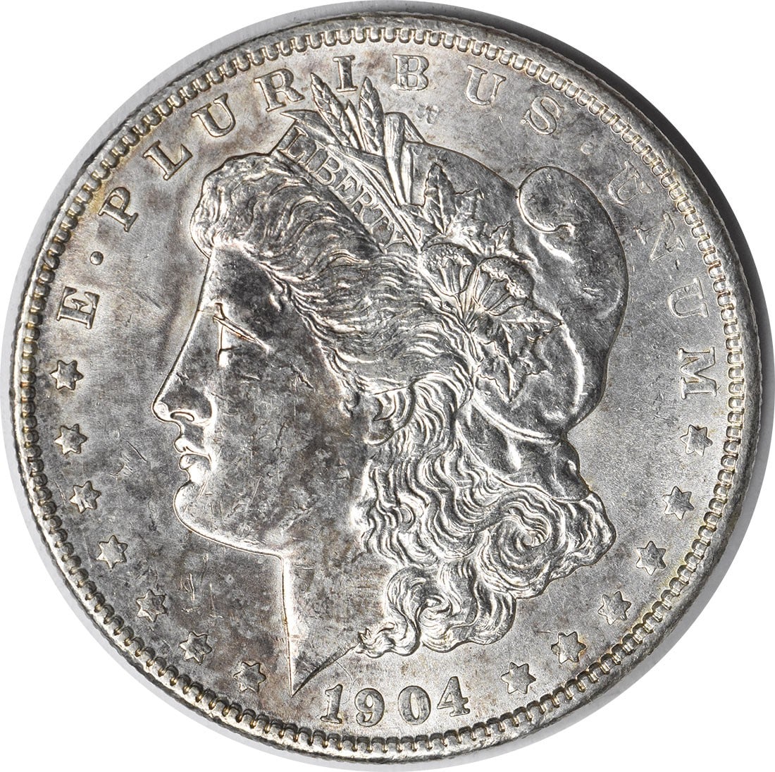 1904 Brilliant Uncirculated Morgan Silver Dollar Uncertified No Mint Mark: 1904 Brilliant Uncirculated Morgan Silver Dollar Uncertified No Mint Mark This 1904 Morgan Silver Dollar is an uncirculated coin with brilliant uncirculated (BU) grade. It is uncertified and features 