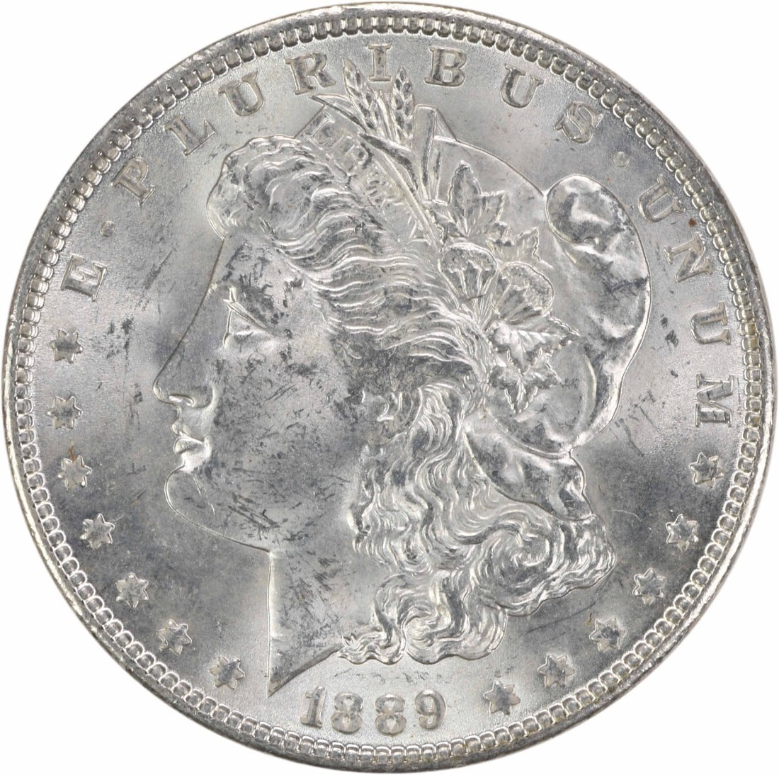 Uncirculated 1889 Silver Dollar Morgan Type Brilliant Uncertified US Coin: Uncirculated 1889 Silver Dollar Morgan Type Brilliant Uncertified US Coin This 1889 Morgan Silver Dollar features brilliant uncirculated condition and is composed of silver. It is uncertified and has 