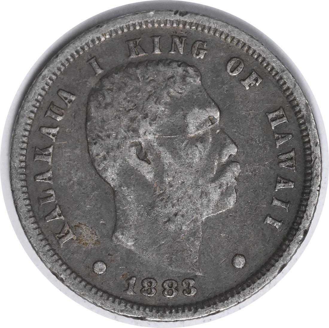 1883 Kingdom of Hawaii silver dime VF uncertified: 1883 Kingdom of Hawaii silver dime VF uncertified This 1883 Hawaiian Dime is a circulated silver coin from the Kingdom of Hawaii. It is graded as VF (Very Fine) and remains uncertified. The coin was m