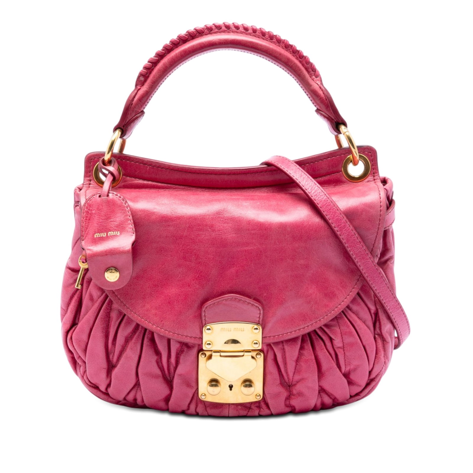 Miu Miu Pink Matelasse Nappa Leather Coffer Satchel: Miu Miu Pink Matelasse Nappa Leather Coffer Satchel This Miu Miu Matelasse Nappa Coffer Satchel features a gathered pink leather exterior with a braided rolled leather handle and a detachable flat lea