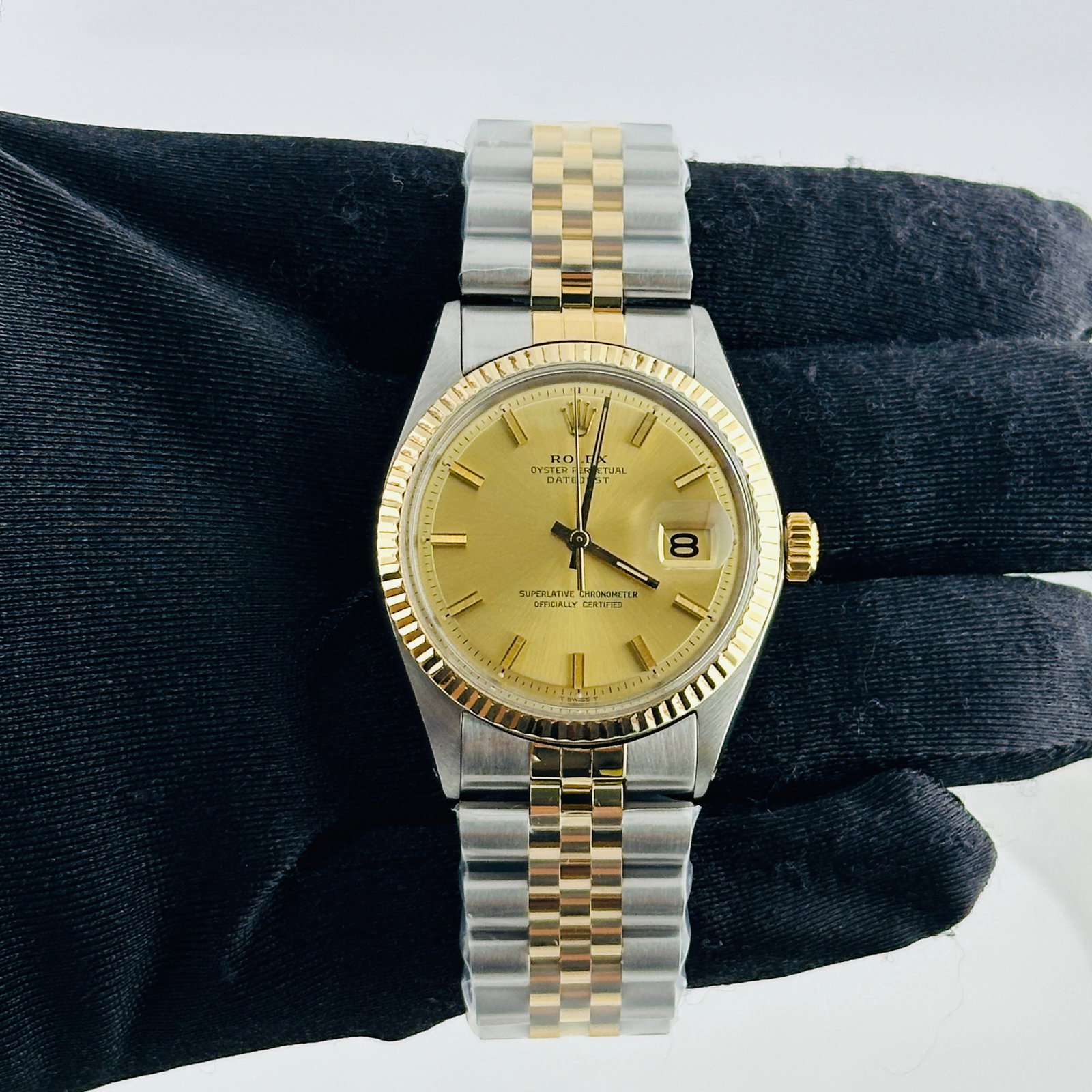 Rolex Datejust 1601 mens watch champagne stick dial aftermarket Jubilee: Rolex Datejust 1601 mens watch champagne stick dial aftermarket Jubilee This Rolex Datejust features a champagne stick dial and a fluted bezel, complemented by a generic leather band. The watch is ide