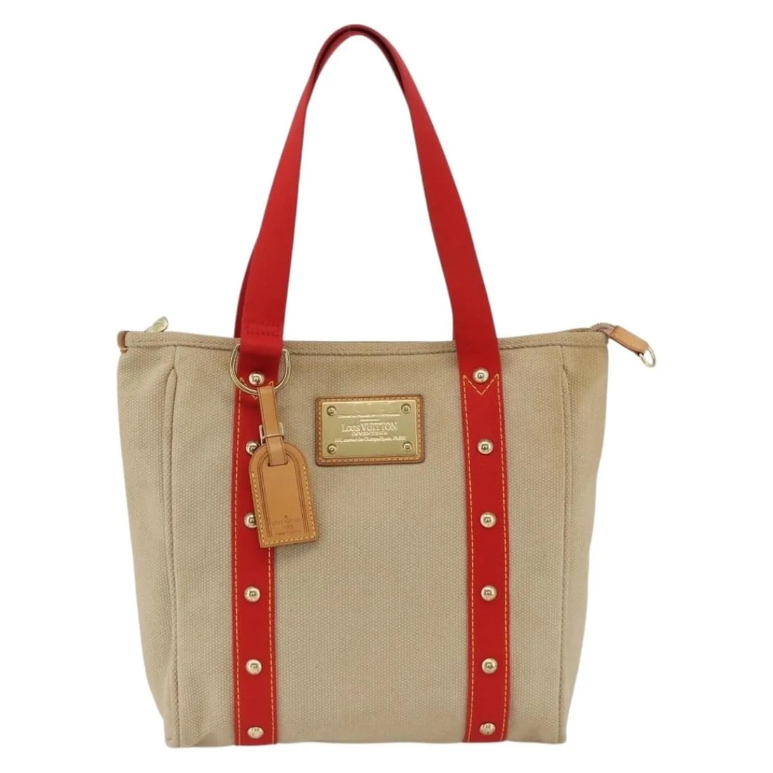Louis Vuitton Antigua Beige Canvas Tote Bag 29cm x 30cm x 9.5cm: Louis Vuitton Antigua Beige Canvas Tote Bag 29cm x 30cm x 9.5cm This Louis Vuitton Antigua Tote is crafted from beige canvas and designed for women. The tote features leather handles and metal fitting