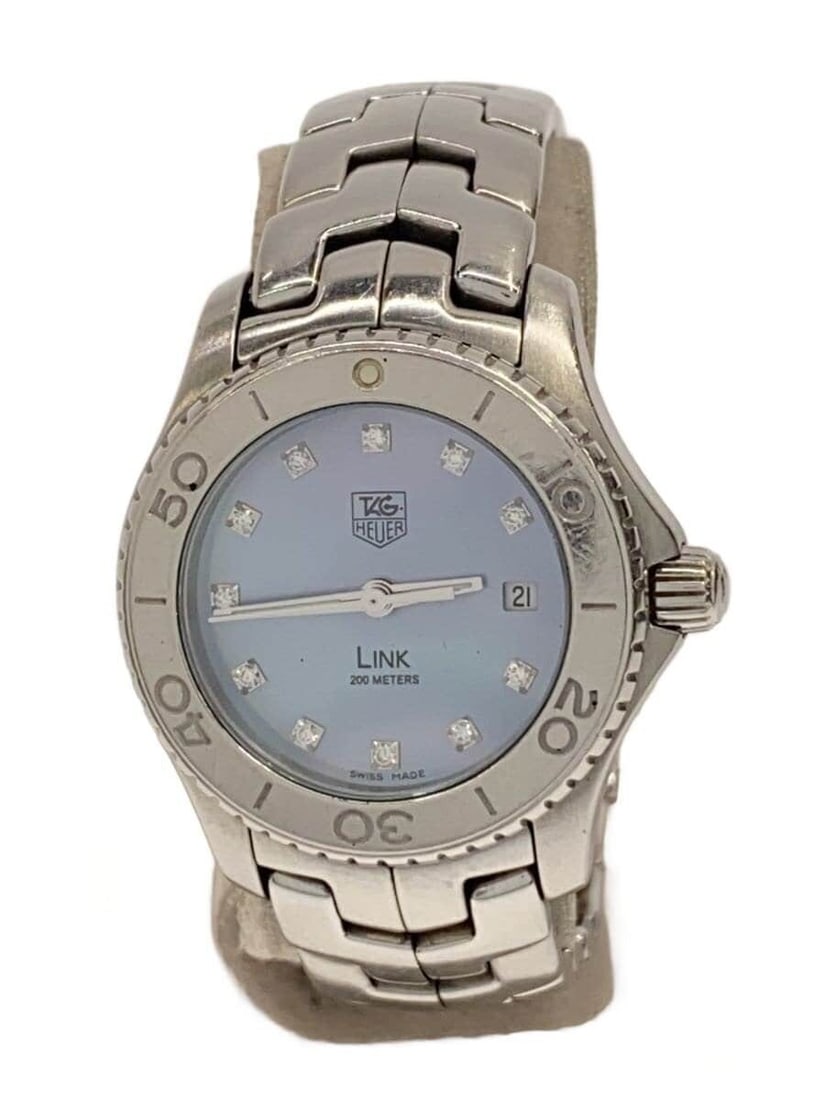 TAG Heuer Link blue stainless steel quartz ladies watch WJ1317.BA0573: TAG Heuer Link blue stainless steel quartz ladies watch WJ1317.BA0573 This TAG Heuer LINK Quartz WJ1317.BA0573 women's wristwatch features a blue dial and a stainless steel case and band. Made in Swit