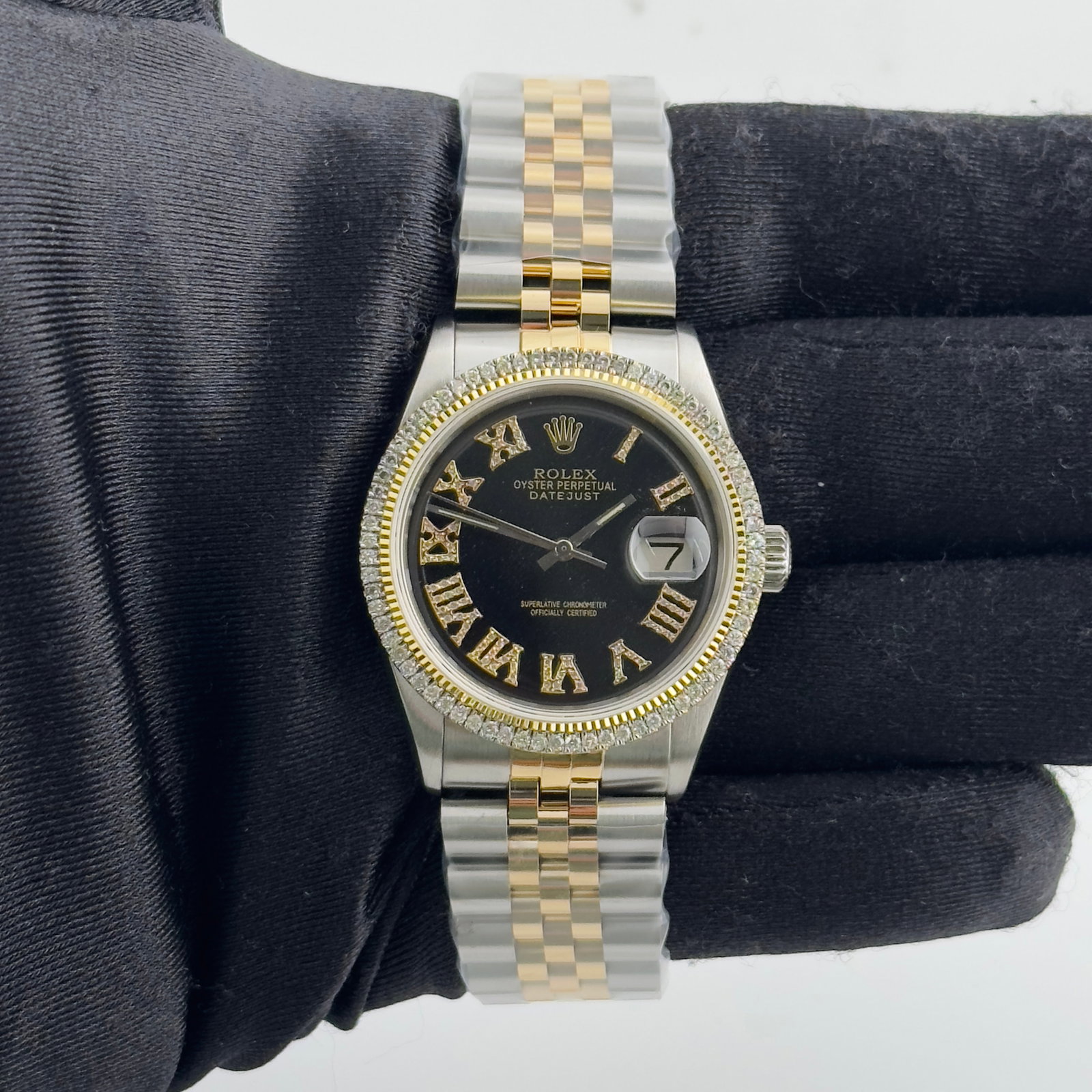 Rolex Aftermarket Black Roman Diamond Dial Jubilee Bracelet for Datejust Ref 1601: Rolex Aftermarket Black Roman Diamond Dial Jubilee Bracelet for Datejust Ref 1601 This Rolex Datejust features an aftermarket black Roman diamond dial and an aftermarket Jubilee bracelet. The watch in