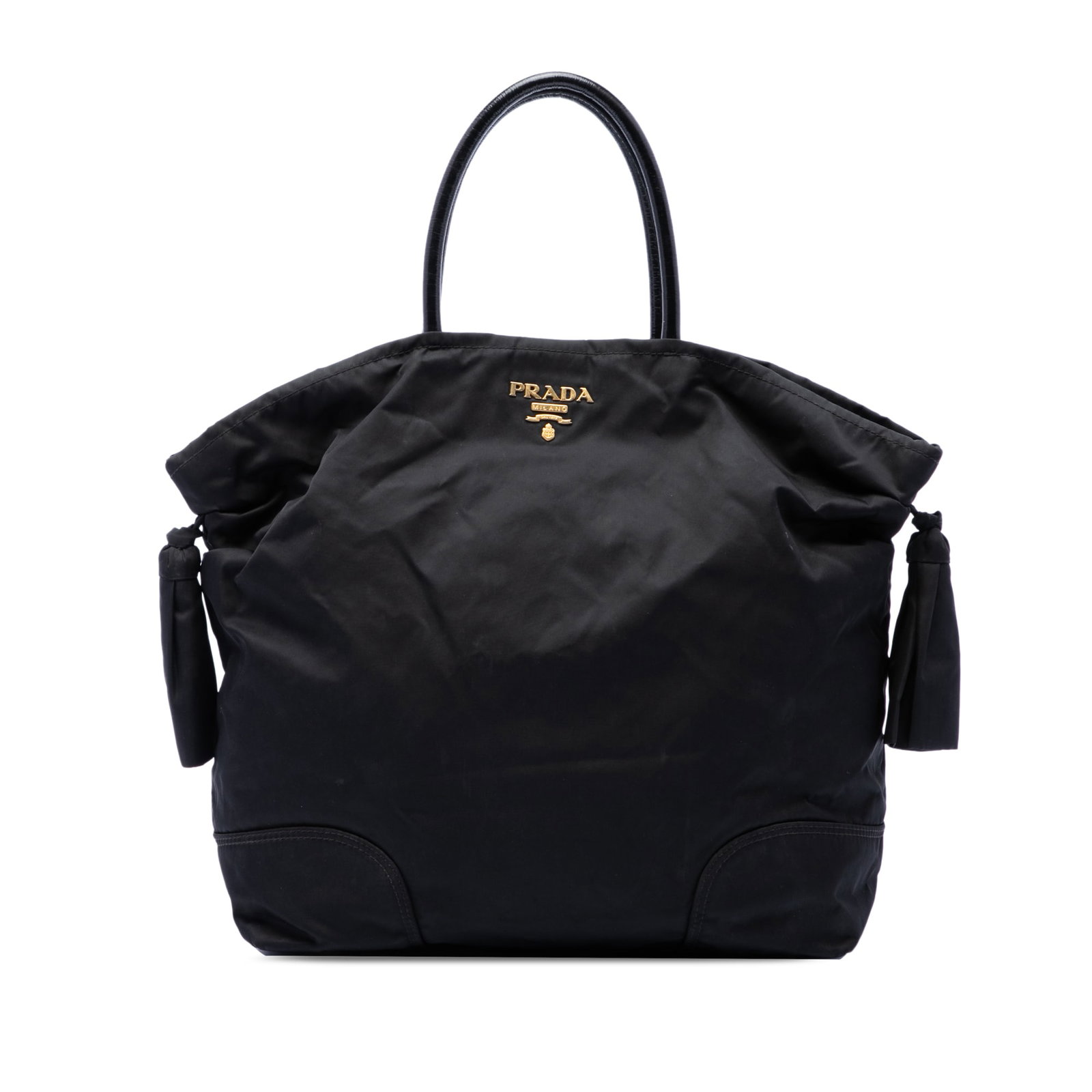 Prada Tessuto Bow nylon tote bag in black: Prada Tessuto Bow nylon tote bag in black Prada Tessuto Bow Tote in black fabric with bow details, rolled handles, an open top with magnetic snap closure, and an interior zip pocket. Made in Italy. Co