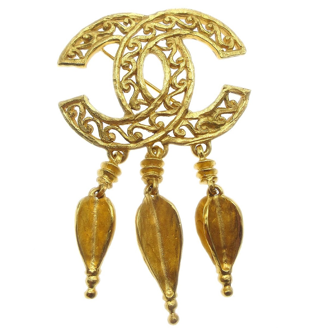Chanel 95A CC Fringe Gold Tone Brooch Pin: Chanel 95A CC Fringe Gold Tone Brooch Pin Add a touch of elegance to your outfit with this stunning Chanel CC Fringe Brooch Pin. Crafted in a luxurious gold-tone metal, this pin features a unique frin