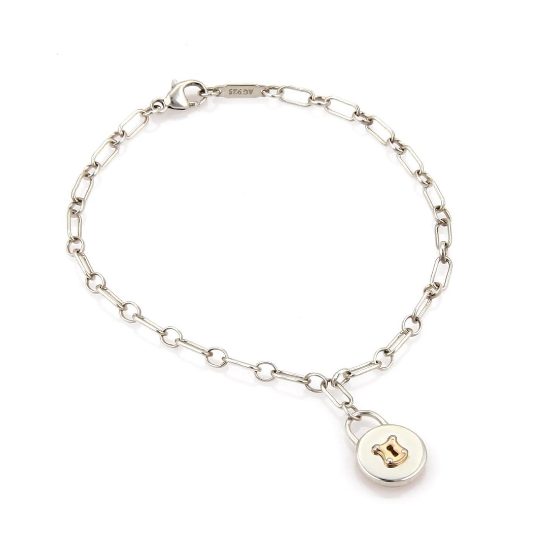 Tiffany & Co. Sterling Silver Padlock Charm Bracelet 18k Rose Gold: Tiffany & Co. Sterling Silver Padlock Charm Bracelet 18k Rose Gold Elevate your accessory collection with this stunning Tiffany & Co. Padlock Charm Bracelet. Expertly crafted from sterling silver and 