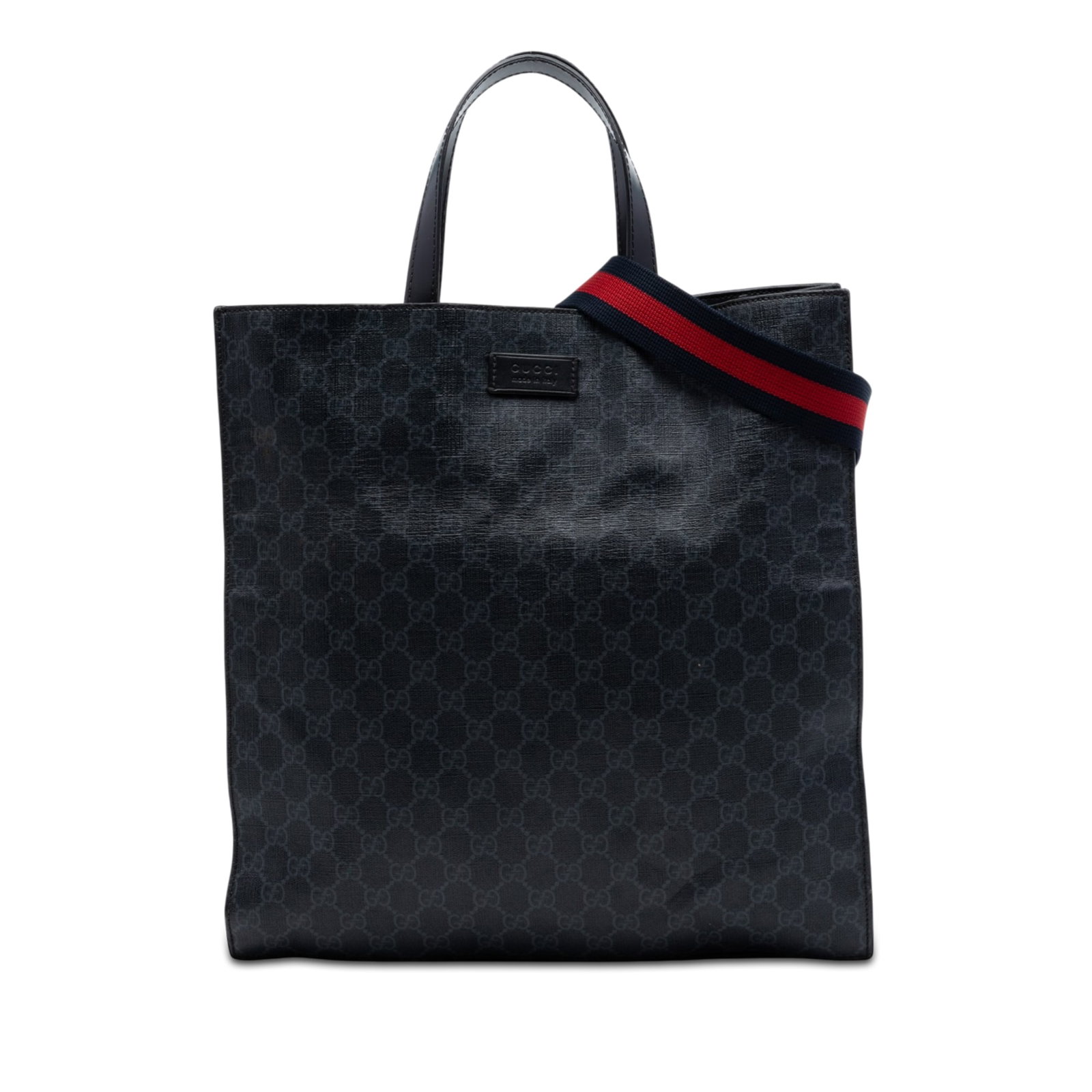 Gucci GG Supreme black coated canvas tote with web strap: Gucci GG Supreme black coated canvas tote with web strap This Gucci GG Supreme Convertible Soft Tote is crafted from coated canvas with flat leather handles and a detachable, adjustable web strap. The