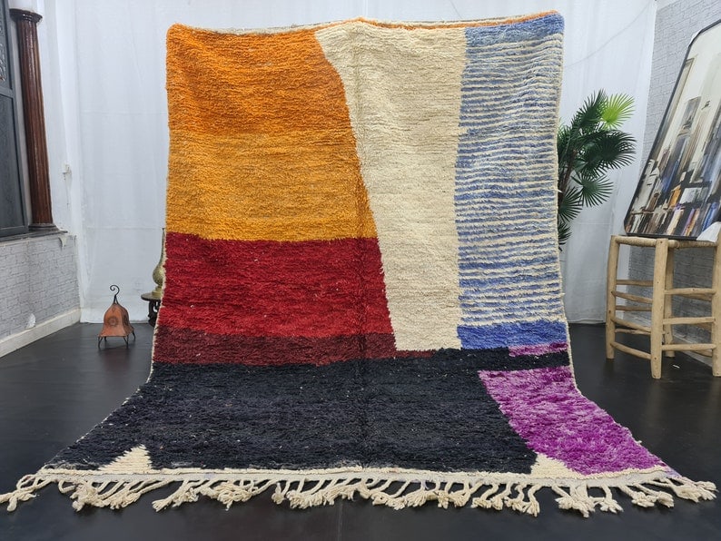 Authentic Moroccan Berber Wool Area Rug 9.84 x 6.56 Feet: Authentic Moroccan Berber Wool Area Rug 9.84 x 6.56 Feet Enhance your space with this authentic, colorful handmade Moroccan Berber wool area rug. Skillfully handwoven by local Berber women weavers in 