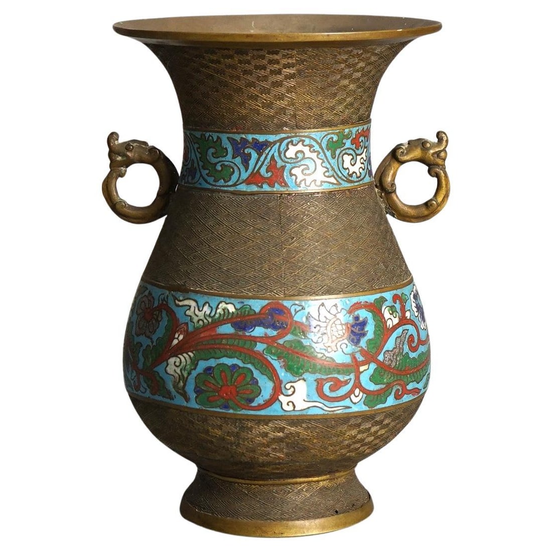 Early 20th Century Chinese Bronze Cloisonne Vase with Dragon Handles: Early 20th Century Chinese Bronze Cloisonne Vase with Dragon Handles This antique Chinese vase from circa 1910 features intricate cloisonne enameling in vibrant blue, red, and green hues set against a