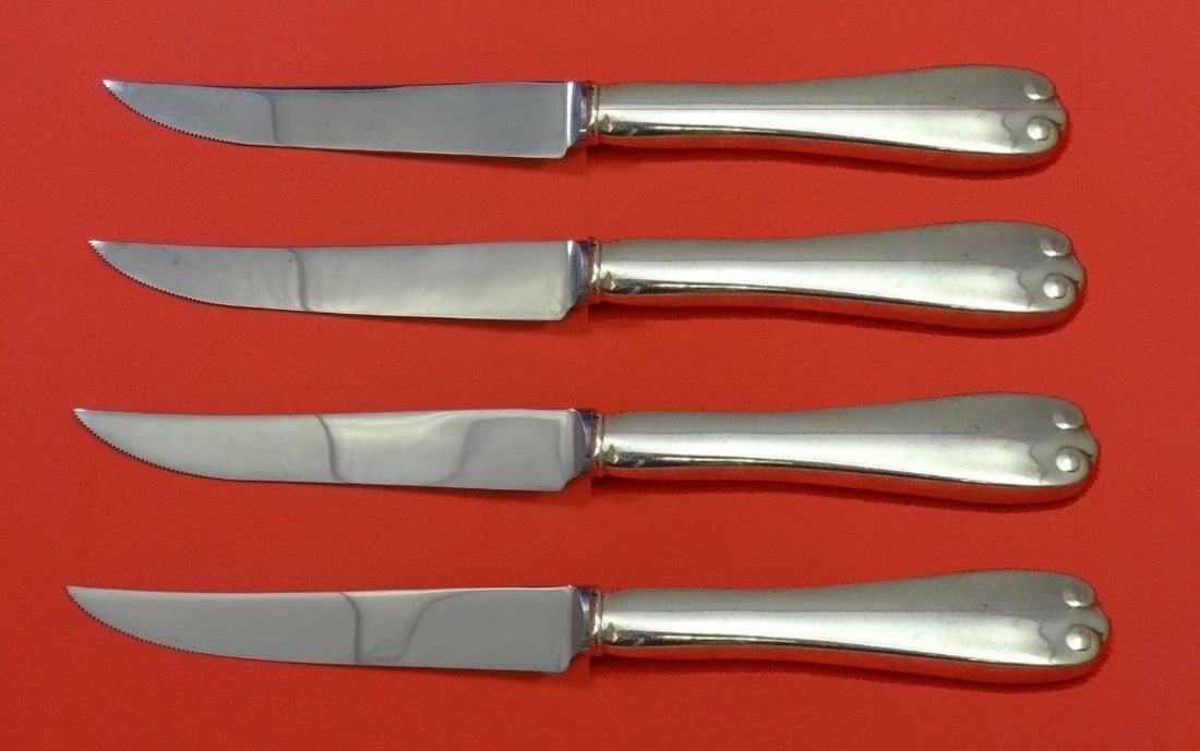 Tiffany & Co. Flemish Sterling Silver Steak Knife Set 4pc Custom 8.5": Tiffany & Co. Flemish Sterling Silver Steak Knife Set 4pc Custom 8.5" Elevate your dining experience with this exquisite 4-piece steak knife set from the Flemish collection by Tiffany & Co. Each knife