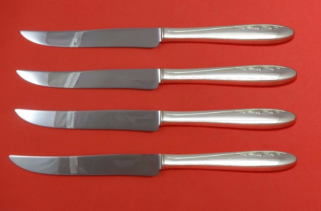 Lunt Spring Serenade Sterling Silver Texas Sized Steak Knife Set 4pc: Lunt Spring Serenade Sterling Silver Texas Sized Steak Knife Set 4pc Introducing the Spring Serenade by Lunt Sterling Silver Steak Knife Set, a stunning 4-piece collection designed for those who appre