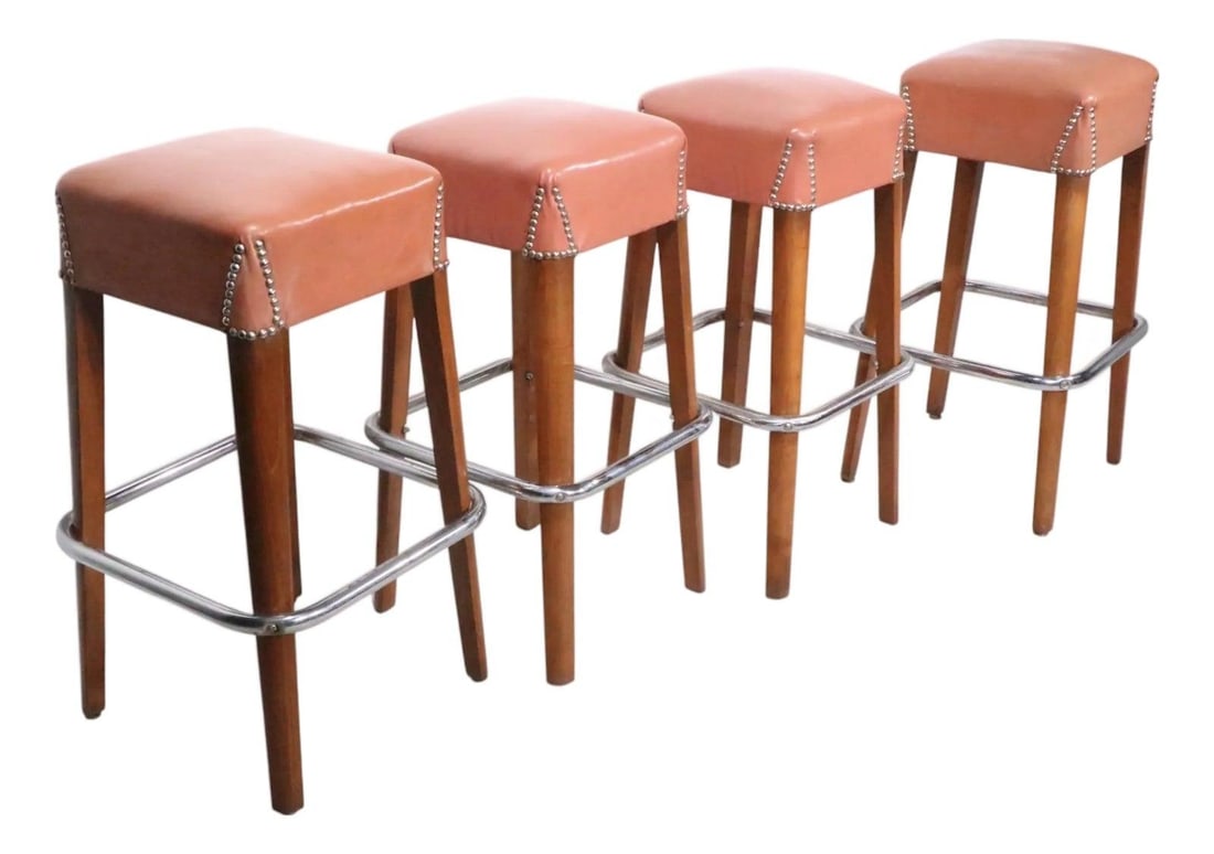 Set of 4 Vintage Bar Stools With Brown Vinyl Seats and Chrome Foot Rails: Set of 4 Vintage Bar Stools With Brown Vinyl Seats and Chrome Foot Rails This set of four classic Mid Century bar stools is attributed to the Chairmaster Company, though unsigned. Each stool features 