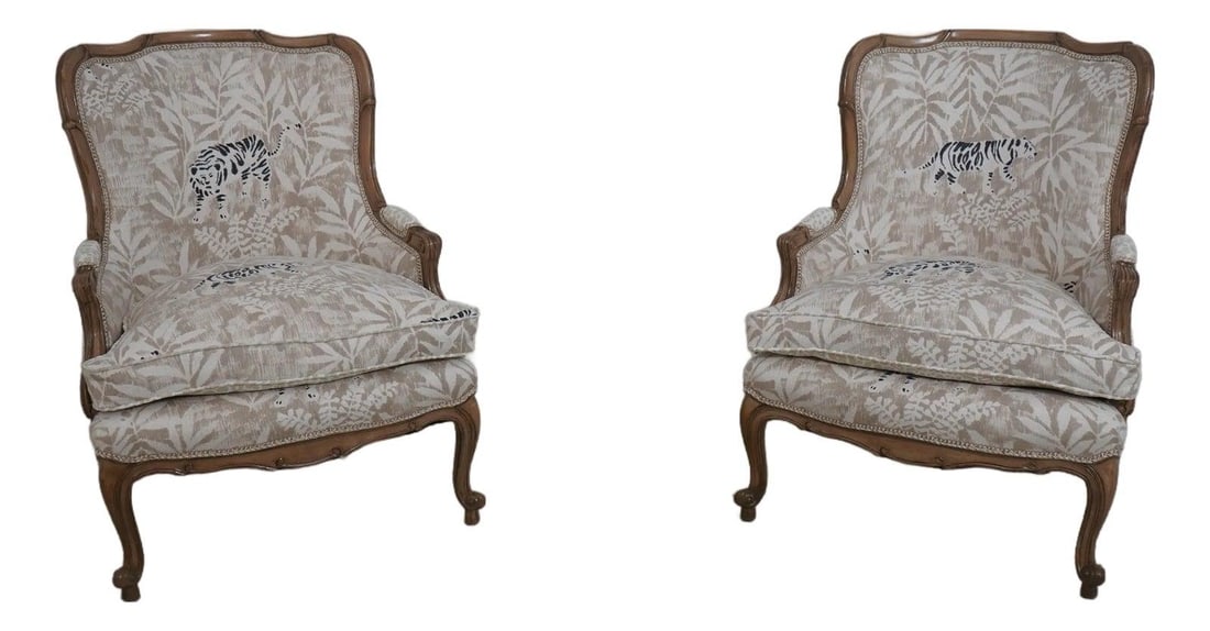 Pair of Newly Upholstered Louis XV Style Animal Print Bergere Chairs: Pair of Newly Upholstered Louis XV Style Animal Print Bergere Chairs This exquisite pair of French Louis XV style Bergere chairs features a striking animal print upholstery with a lion motif, newly up