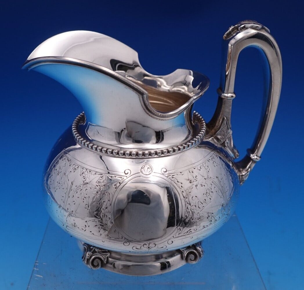 Tiffany & Co Sterling Silver Ivy Creamer Antique 1850-1899 #1375/1441: Tiffany & Co Sterling Silver Ivy Creamer Antique 1850-1899 #1375/1441 This exquisite creamer by Tiffany & Co. features the elegant Ivy pattern, also known as Antique Ivy Engraved. Crafted from high-qu