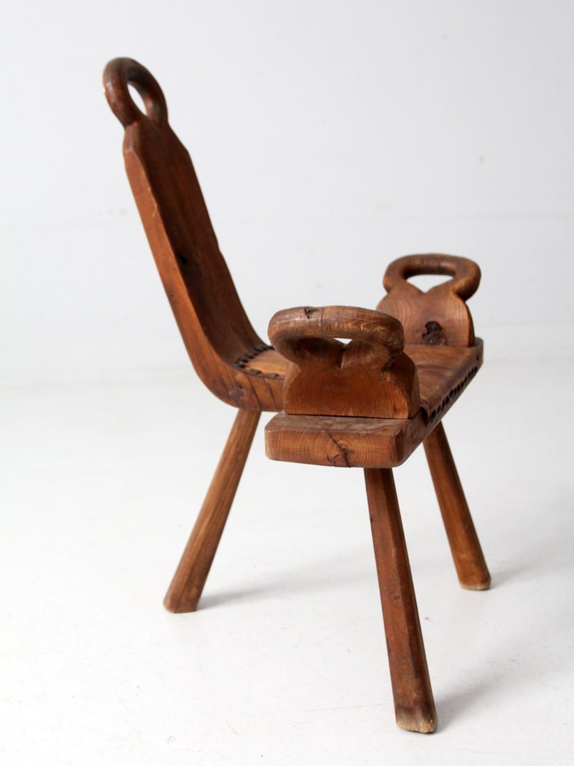 Mid-Century Spanish Brutalist Stool Rustic Wood Design with Leather Seat: Mid-Century Spanish Brutalist Stool Rustic Wood Design with Leather Seat This mid-century Spanish Brutalist stool features a unique rustic wood midwife's chair design. It includes a sloped back, conve