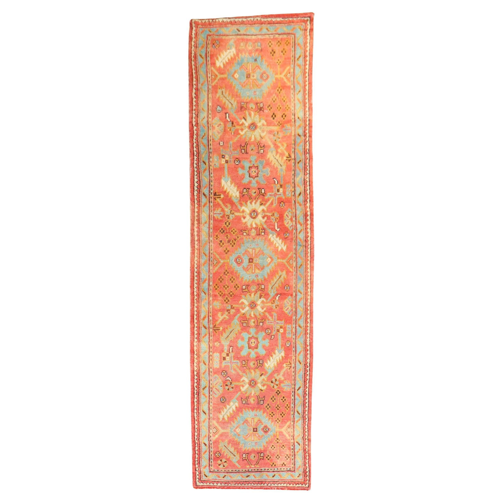 Early 1900s Turkish Oushak Wool Runner Rug in Orange Red Tones: Early 1900s Turkish Oushak Wool Runner Rug in Orange Red Tones This early 20th century Turkish Oushak runner features dominant orangey red tones and a traditional design. Hand-woven from wool, this an