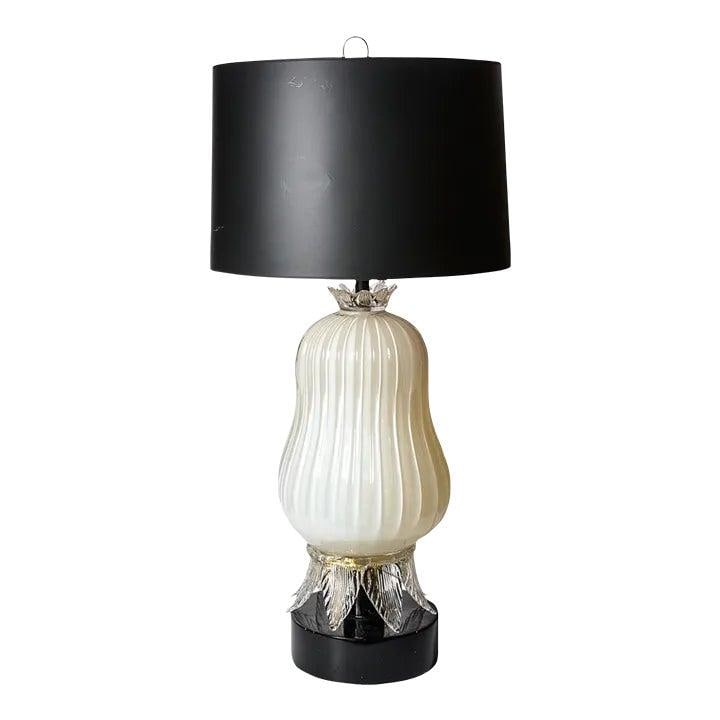 Mid Century Italian Murano Glass Bulbous Table Lamp in Black Wood Base: Mid Century Italian Murano Glass Bulbous Table Lamp in Black Wood Base This exquisite Mid Century Italian Murano Glass Bulbous Table Lamp features a stunning ribbed design, showcasing the craftsmanshi